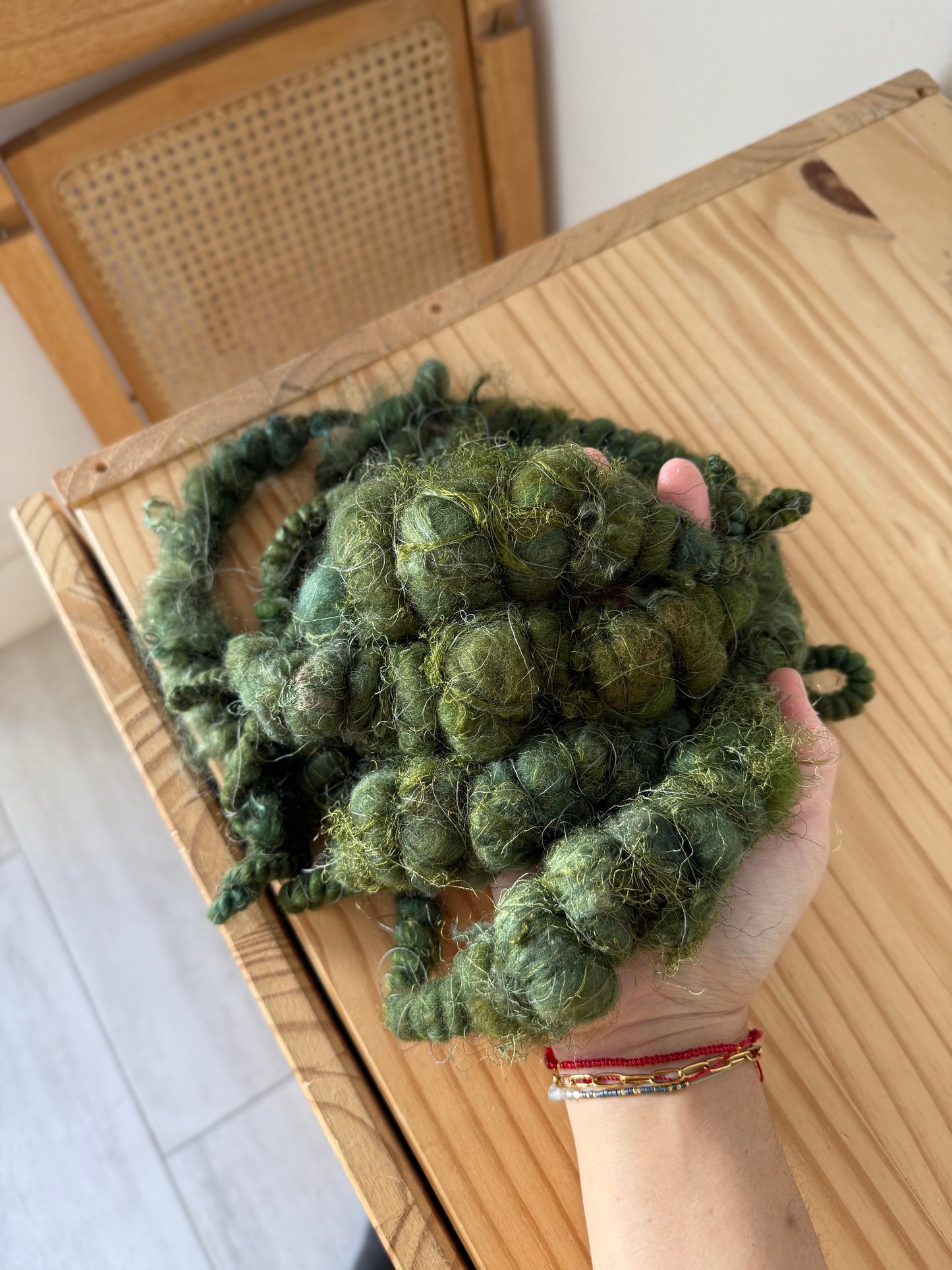 super jumbo coiled art yarn in forest green