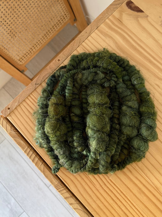 super jumbo coiled art yarn in forest green